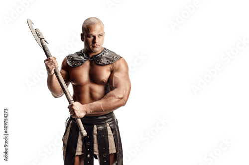 Studio shot of muscular ancient warrior man posing with axe. Isolated on white. Copy space