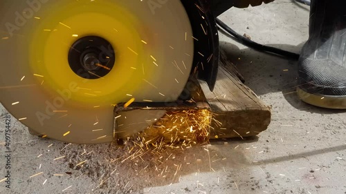 Man cutting steel beam. Cutting sparks.

