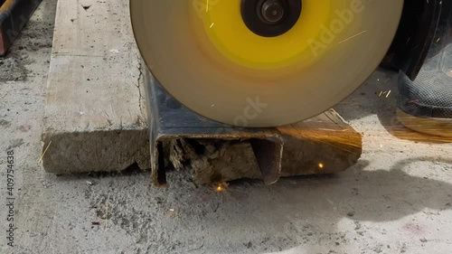 Man cutting steel beam. Cutting sparks.

