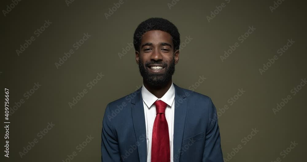 Beautiful happy handsome man with facial expressions in front of a colored background Beautiful happy handsome man with facial expressions in front of a colored background