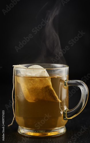 Chamomile tea on black background
