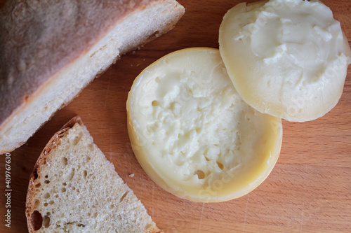 Top view of Azeitao cheese, a creamy and semi soft portuguese cheese with bread photo