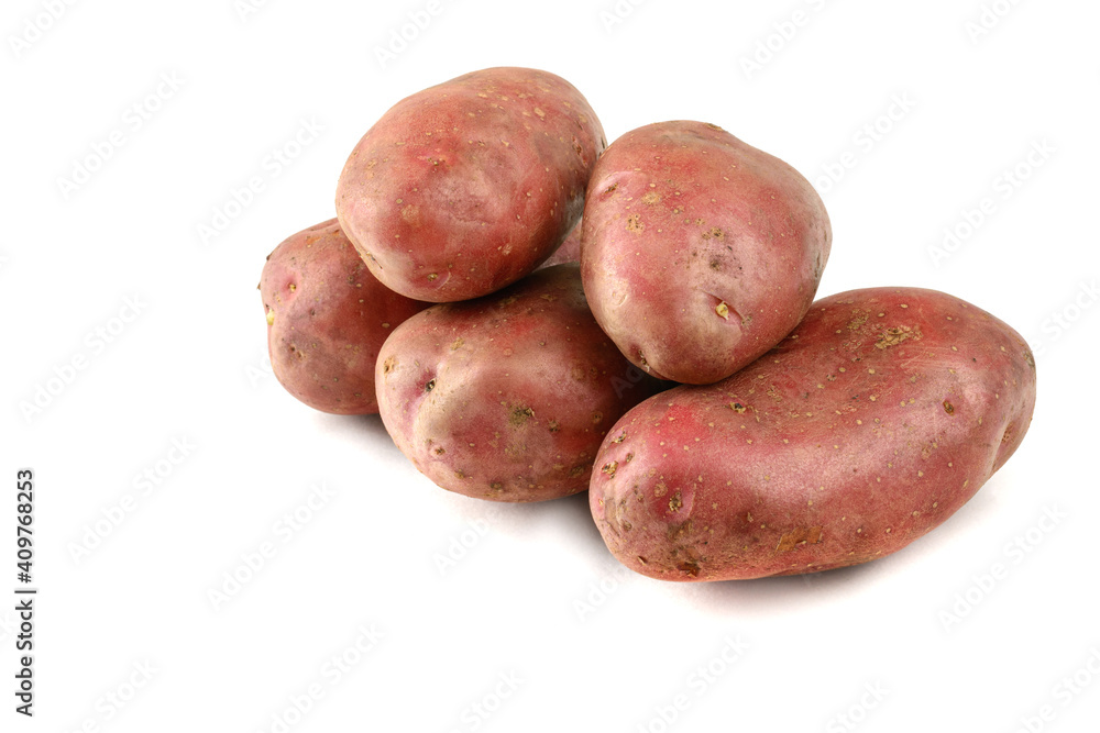 Raw pink potato tubers on a white isolated background.Potatoes in the skin. Raw pink potato tubers on a white isolated background.Potatoes in the skin.