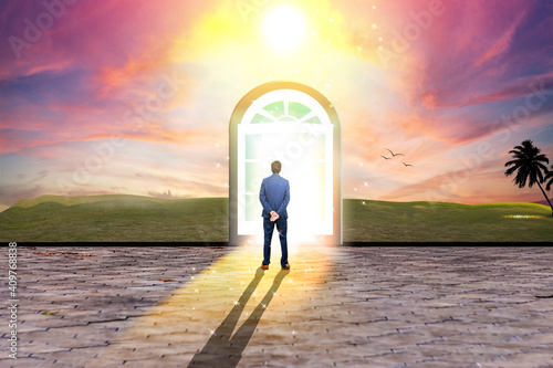 Fotografie Businessman standing in front of magical door that opens for new opportunities o