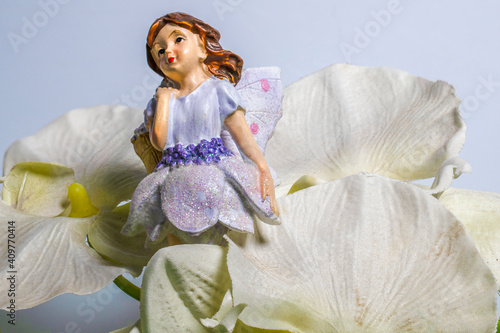 Laveder fairy in orchid flowers photo