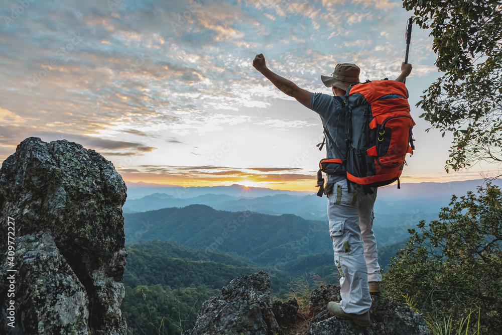 Hiker with backpack standing on top mountain sunset background. Hiker man hiking living healthy active lifestyle. - obrazy, fototapety, plakaty 