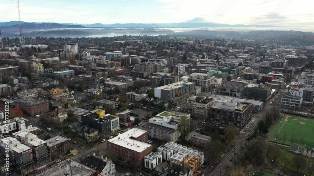 Cinematic aerial - drone trucking shot of Capitol Hill, Pike - Pine, First Hill, Cherry Hill, Squire Park Minor, Atlantic, downtown Seattle with Mt Rainier in the morning in King County, Washington Cinematic aerial - drone trucking shot of Capitol Hill, Pike - Pine, First Hill, Cherry Hill, Squire Park Minor, Atlantic, downtown Seattle with Mt Rainier in the morning in King County, Washington