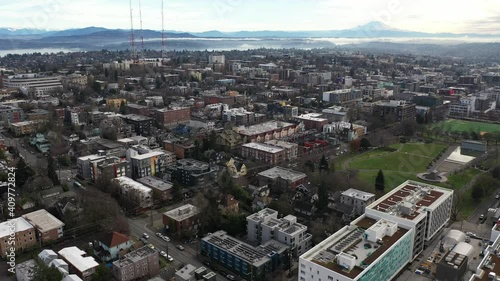 Cinematic aerial - drone dolly shot of Capitol Hill, Pike - Pine, First Hill, Cherry Hill, Squire Park Minor, Atlantic, downtown Seattle with Mt Rainier in the morning in King County, Washington photo