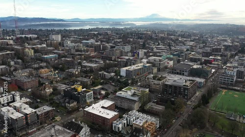 Cinematic aerial - drone trucking shot of Capitol Hill, Pike - Pine, First Hill, Cherry Hill, Squire Park Minor, Atlantic, downtown Seattle with Mt Rainier in the morning in King County, Washington photo