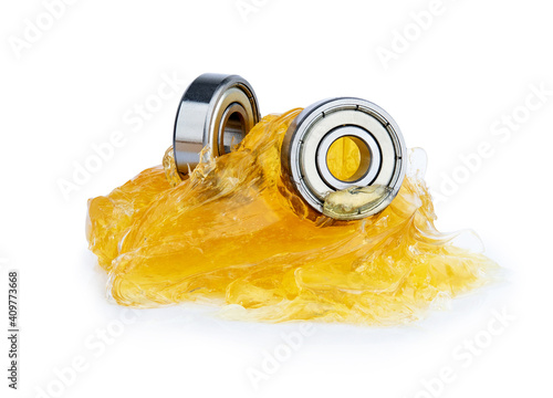 Ball bearing with yellow grease isolated on white background photo