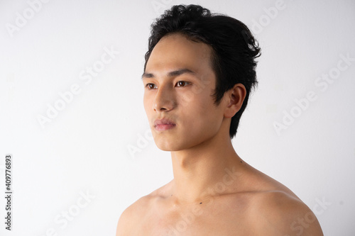 Portrait of handsome young man with clean muscles and skin