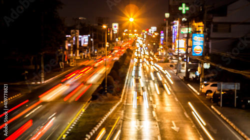 Blurred traffic at night in downtown Chiangmai Thailand