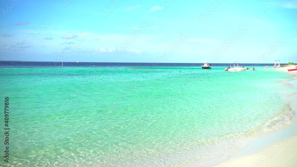 Beautiful Beach on a sunny day with clear blue water on Maldives Islands Beautiful Beach on a sunny day with clear blue water on Maldives Islands