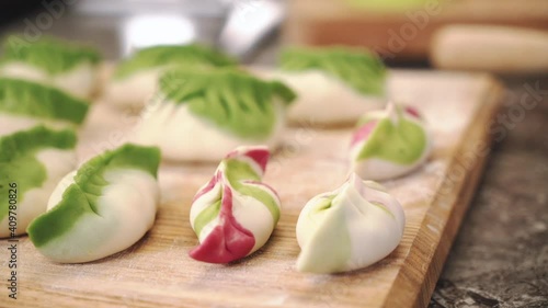 Chef cooking gyoza with meat. Handmade dumplings. The process of making dumplings. 