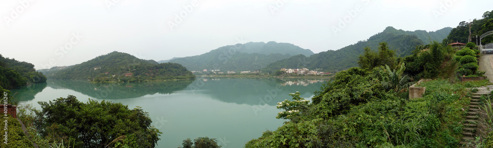 Fototapeta premium Many Vernicia fordii blossom by the river