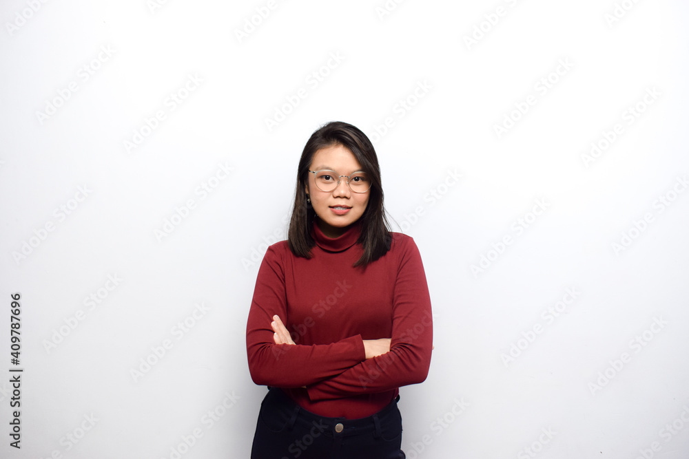 Crossed arms and looking at camera of Young beautiful asian women dress red shirt isolated on white background Crossed arms and looking at camera of Young beautiful asian women dress red shirt isolated on white background