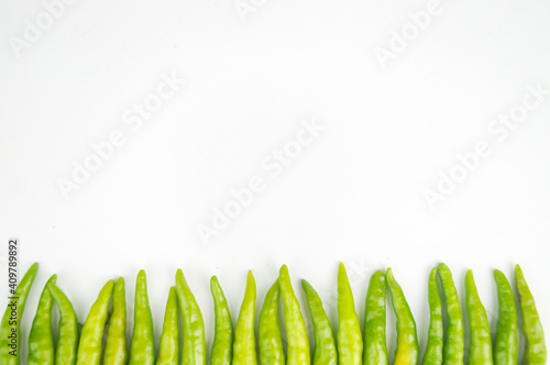 Green Thai chile peppers vary in size and shape, depending on the specific variety, and are generally small, conical, and slender, tapering to a point on the non-stem end.