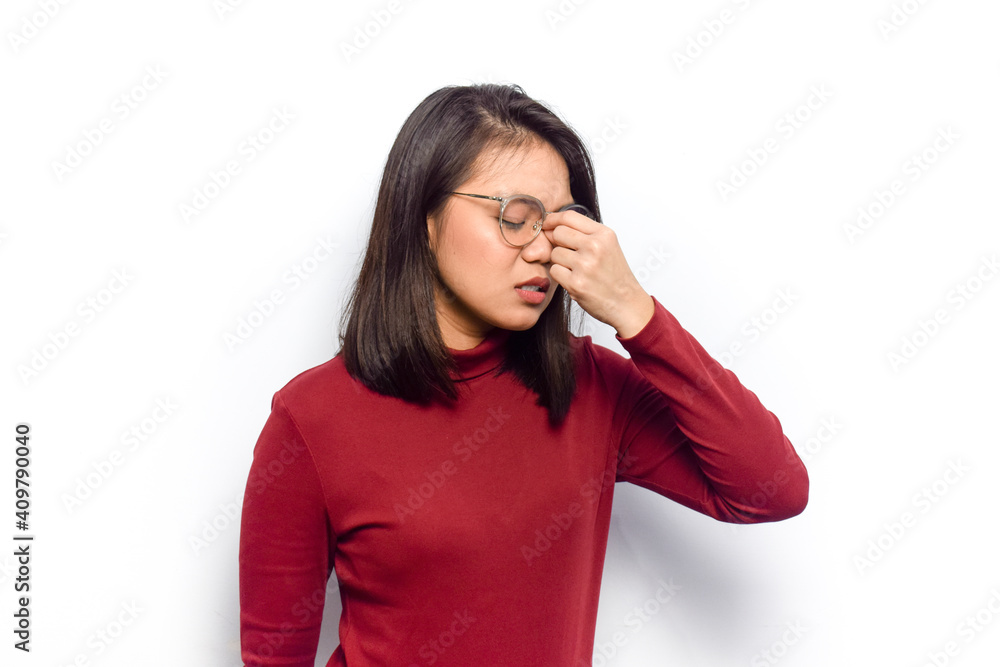 Headache with hand on nose gesture concept of Young beautiful asian women dress red shirt isolated on white background