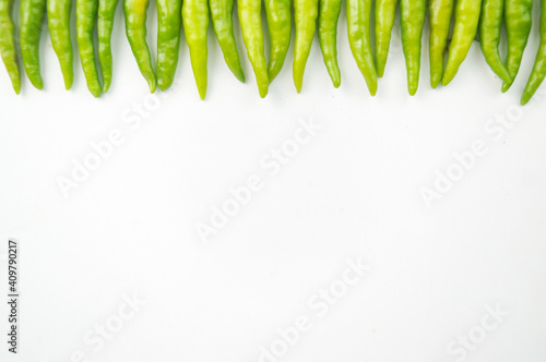 Green Thai chile peppers vary in size and shape, depending on the specific variety, and are generally small, conical, and slender, tapering to a point on the non-stem end.