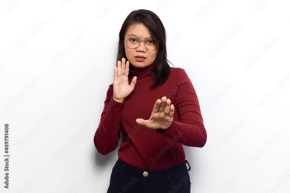 Doing stop gesture of Young beautiful asian women dress red shirt isolated on white background Doing stop gesture of Young beautiful asian women dress red shirt isolated on white background