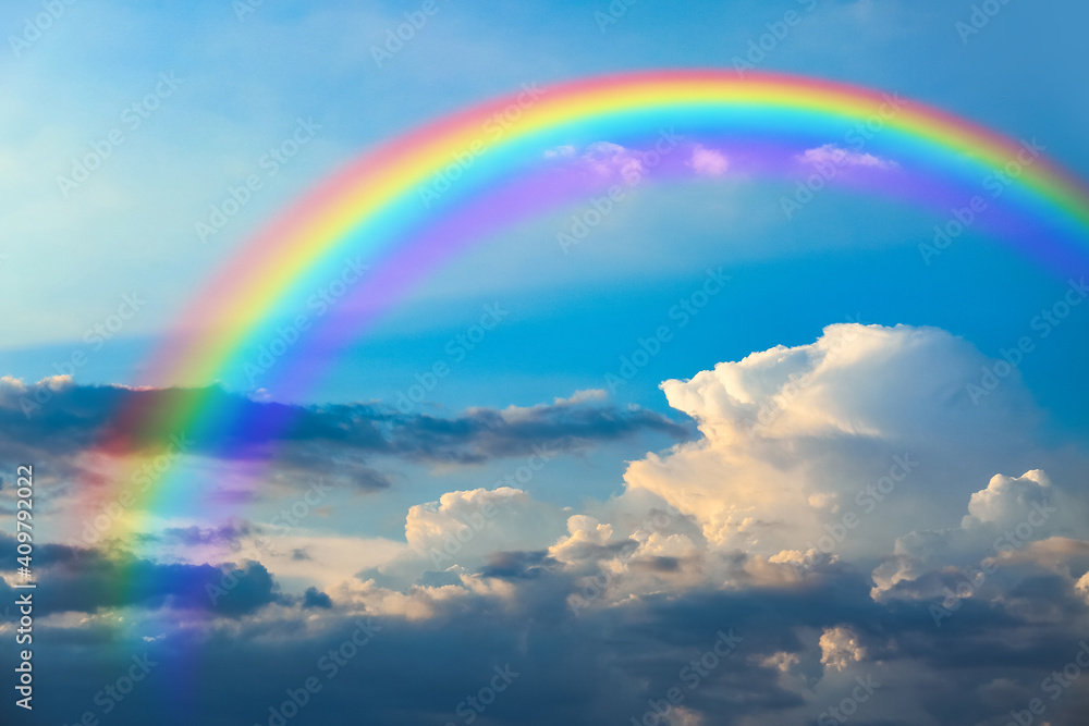 Beautiful view of blue sky with clouds and rainbow Beautiful view of blue sky with clouds and rainbow