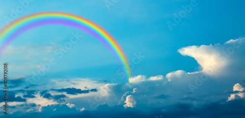 Beautiful view of blue sky with clouds and rainbow © Pixel-Shot