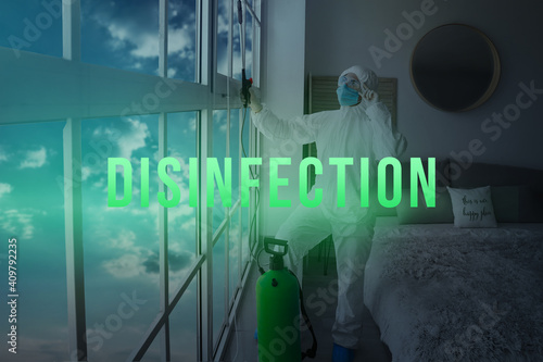 Worker in biohazard suit di...