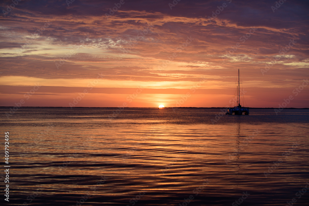 Sea boats at sunset. Ocean yacht sailing on water. Yachting. Sea boats at sunset. Ocean yacht sailing on water. Yachting.