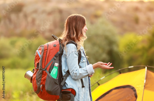 Young woman hiker with back...