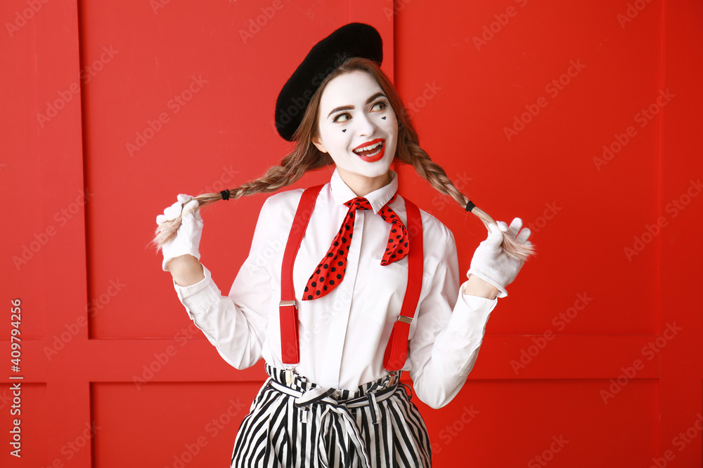 Female pantomimist on color background Female pantomimist on color background