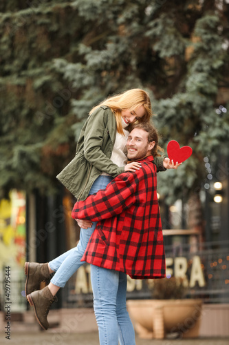 Happy young couple walking ...