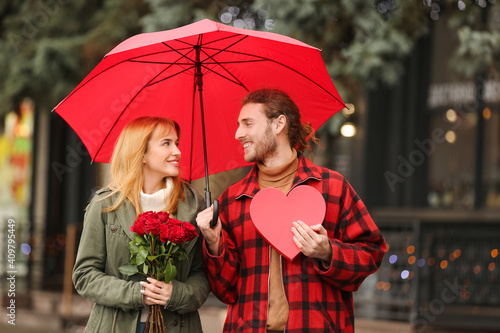 Happy young couple walking ...