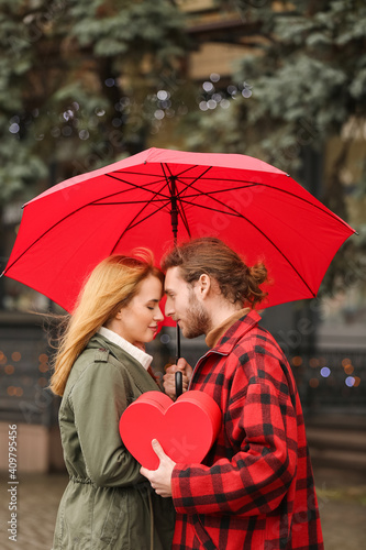Happy young couple walking ...