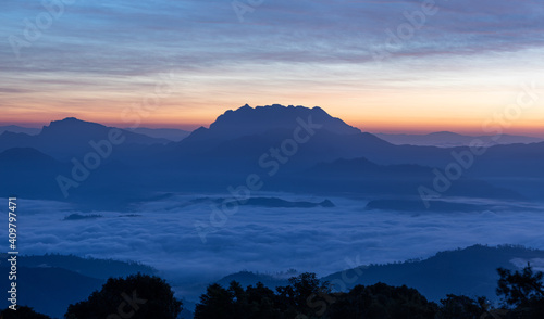 mountain and sea of fog sunrise surrounded with mountain and forest at huai nam dang national park chiang mai  thailand