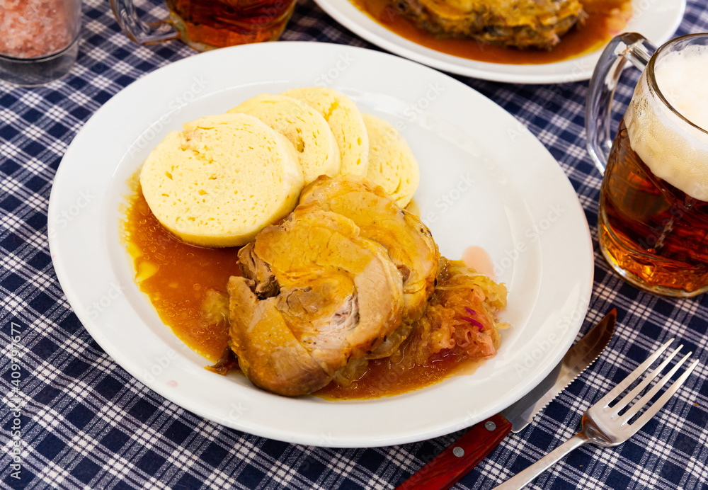 Traditional old Bohemian dumplings served with sauerkraut and baked pork. Dish of Czech cuisine