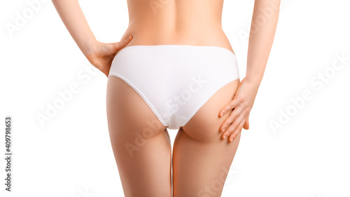 Beautiful sexy female ass in white underwear. Concept for diet, anti-cellulite products, skin care and sports, white isolated background.