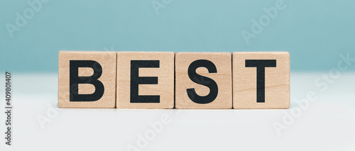 Best - word concept from wooden blocks on blue background