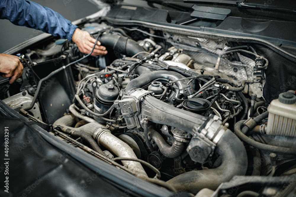 Dirty engine under the hood of a car Dirty engine under the hood of a car