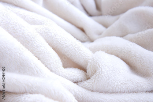 Light soft, fluffy, light blanket. Texture white cotton towel background