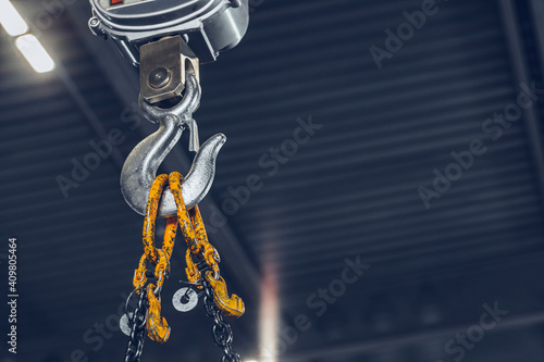 Huge hook with steel chain in a factory photo