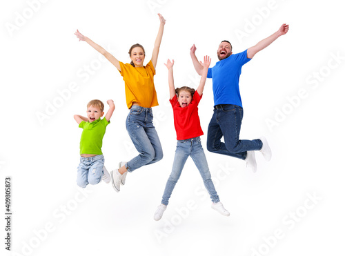 Delighted family jumping together in studio