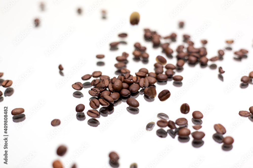 Falling coffee beans. White background. Falling coffee beans. White background.