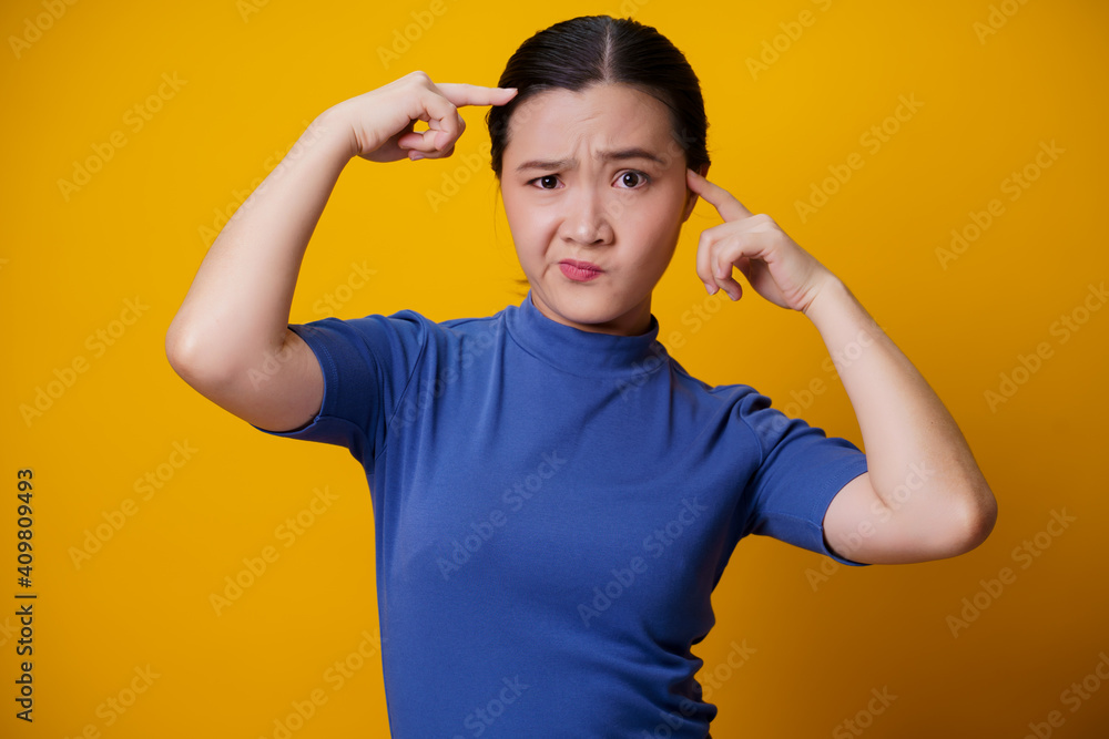 Confused Asian woman isolated on background. Confused Asian woman isolated on background.