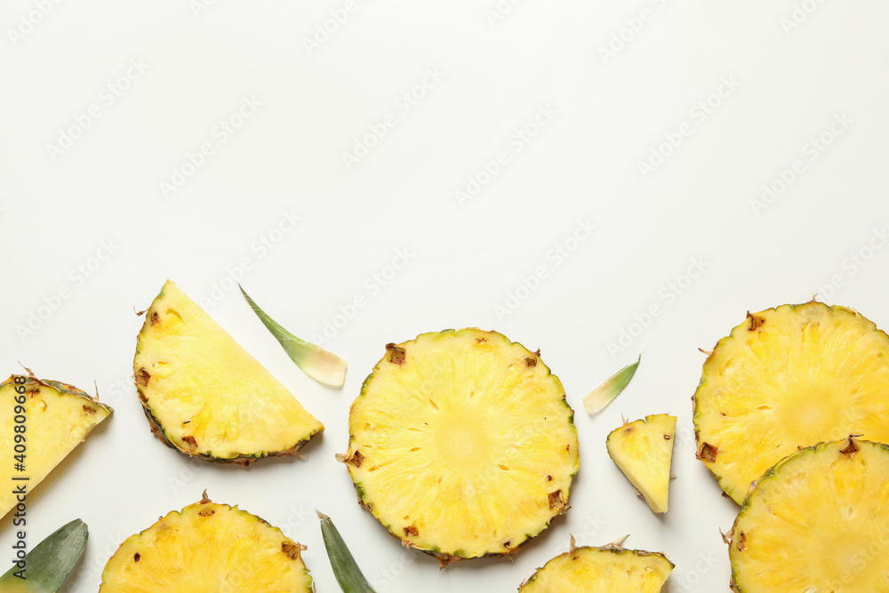 Flat lay with pineapple slices on white background, top view Flat lay with pineapple slices on white background, top view