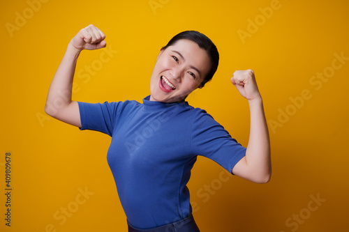 Healthy woman isolated over yellow background.