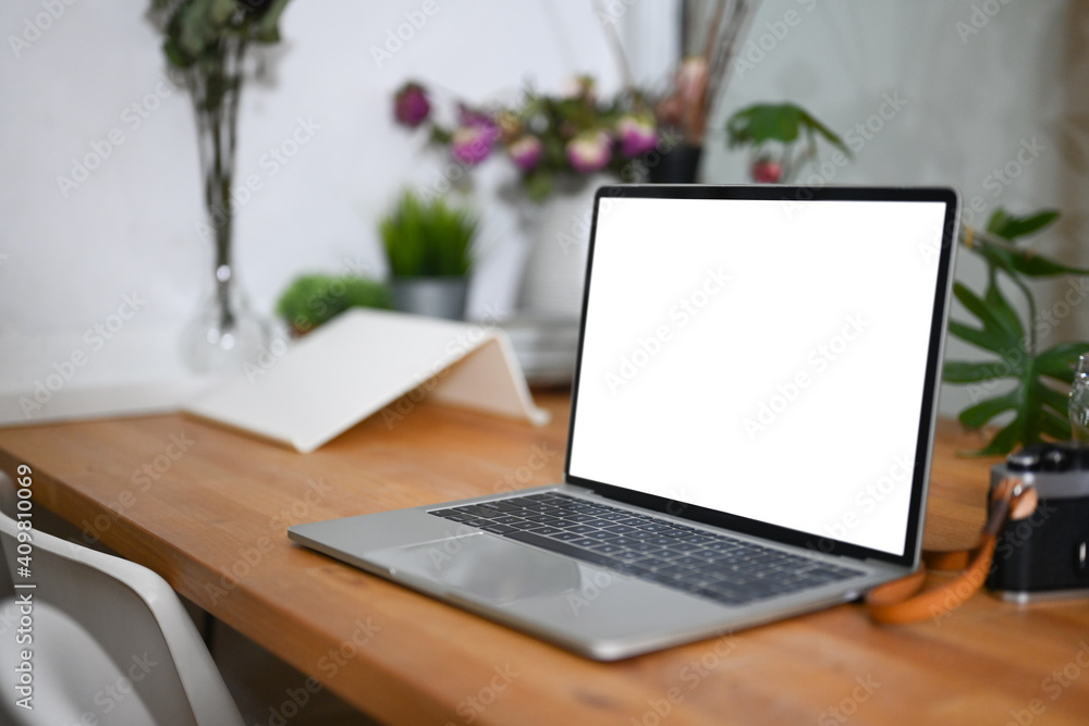 Mock up laptop computer with blank screen on photographer workspace. Mock up laptop computer with blank screen on photographer workspace.