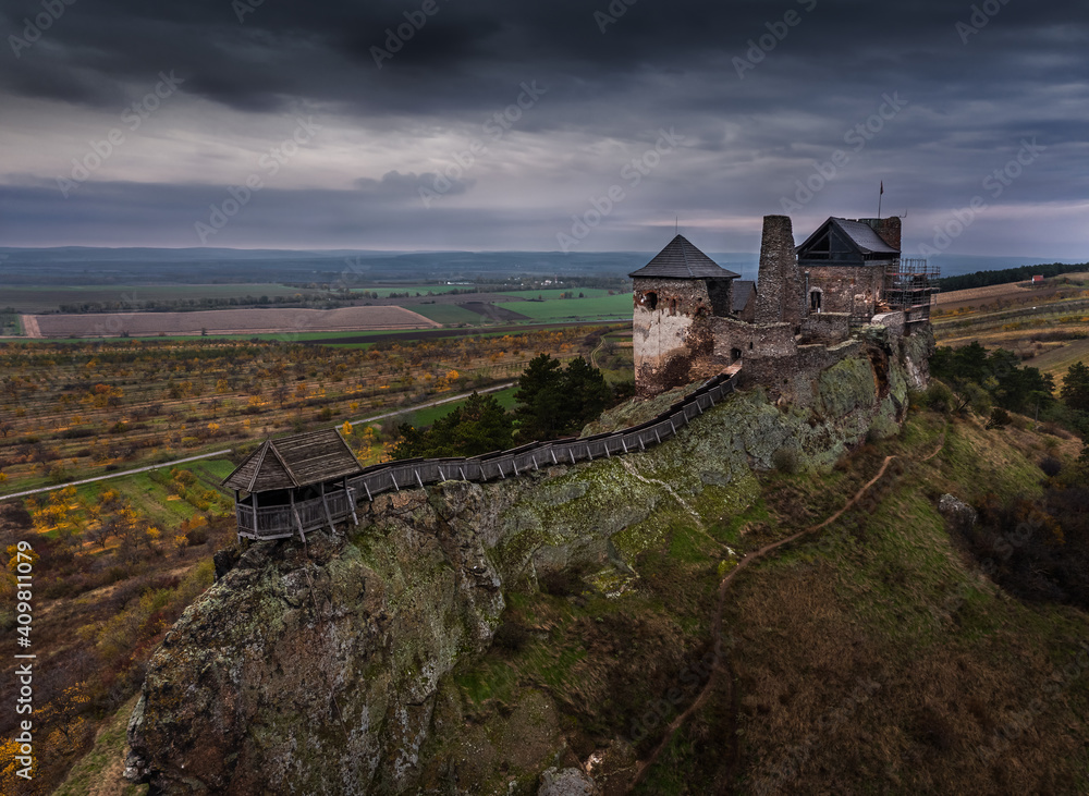 Boldogko, Hungary - Aerial view of Boldogko Castle (Boldogko vára/Boldogkováralja) at autumn season with dark storm clouds at background. The castle can be found in the Zemplen Mountains