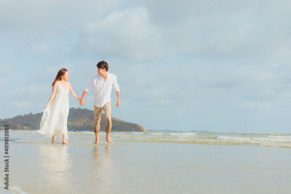 Love young couple holding hands and running on the beach. Holiday and vocation concept. Love young couple holding hands and running on the beach. Holiday and vocation concept.