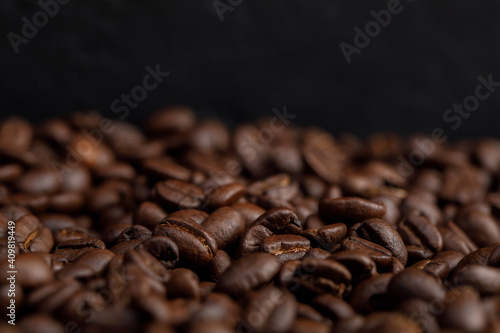 The hot of brown roasted coffee beans on brown background with copyspace, Healthy products by organic natural ingredients concept