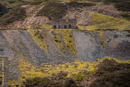 The remains of Bunton Mine with the Gunnerside Gill landscape, near Gunnerside, North Yorkshire, England, UK photo